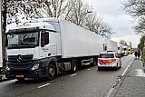 14-12-2020 Breda- Ondertussen stond er al een flinke file met vrachtwagens vol levensmiddelen. - Fotokrant