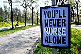 17-04-2020 Breda - In de stad hangen tijdens de Coronacrisis om zorgmedewerkers een hart onder de riem te steken posters met de tekst You’ll Never Nurse Alone  . - Fotokrant